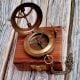 Brass Pocket Compass Displayed on Wooden Box